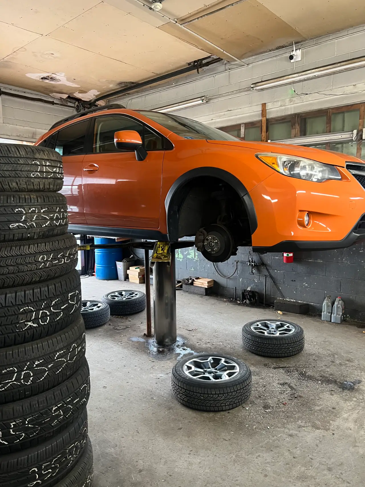 Inspecting a punctured tire for repair in Warren, Rhode Island