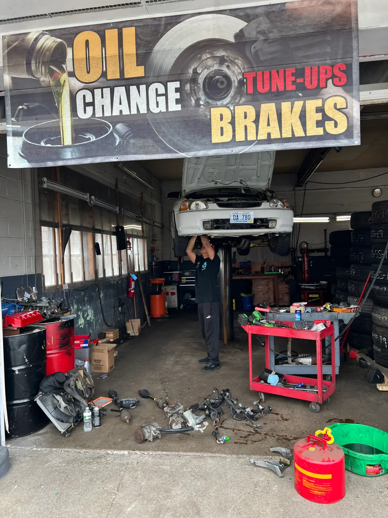 Technician inspecting a wobbling tire in Warren, Rhode Island